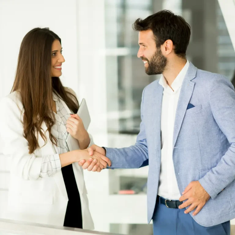Man and woman shaking hand partnership in business