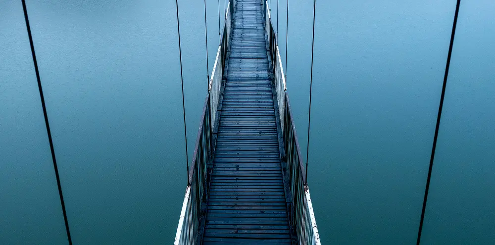 Bridge spanning over blue water