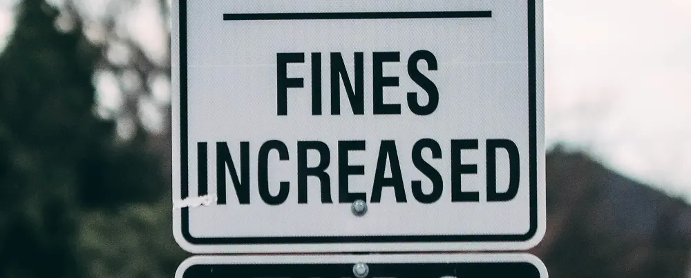 Road sign displaying the message Fines Increased