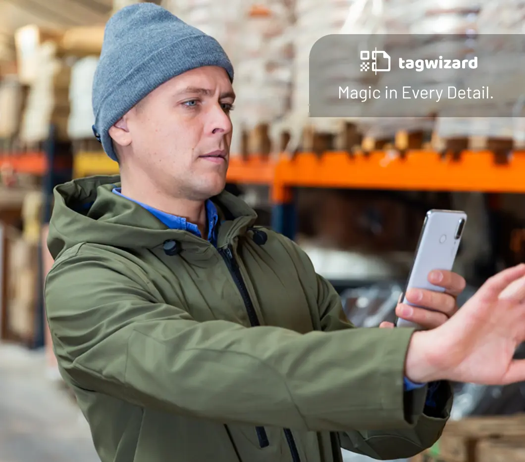 Man using his mobile phone to tag assets and detect refrigerant leaks