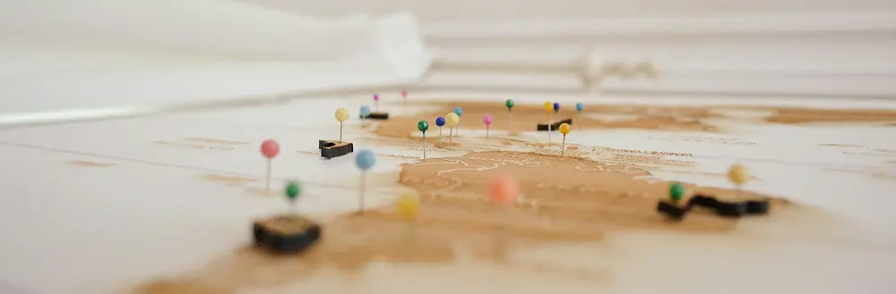 Map with multiple colored pins marking various geographic locations