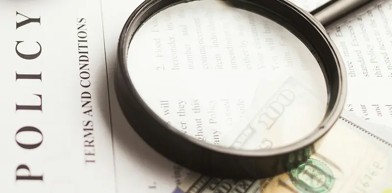Policy document with a magnifying glass