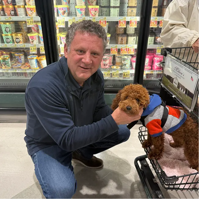 Ted Atwood and a cute dog in a grocery store detecting refrigerant leaks